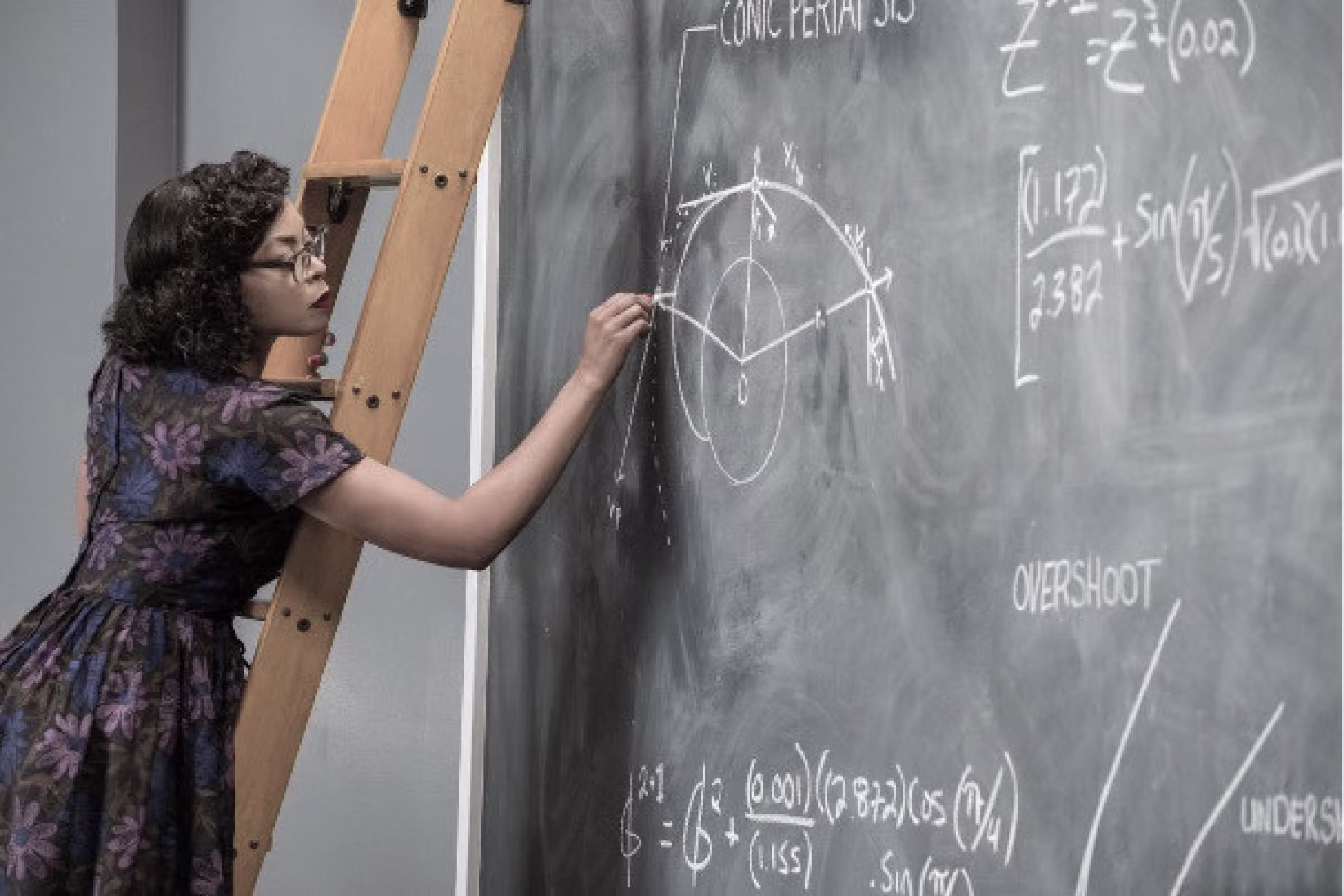 Photo of Katherine Johnson writing on a board